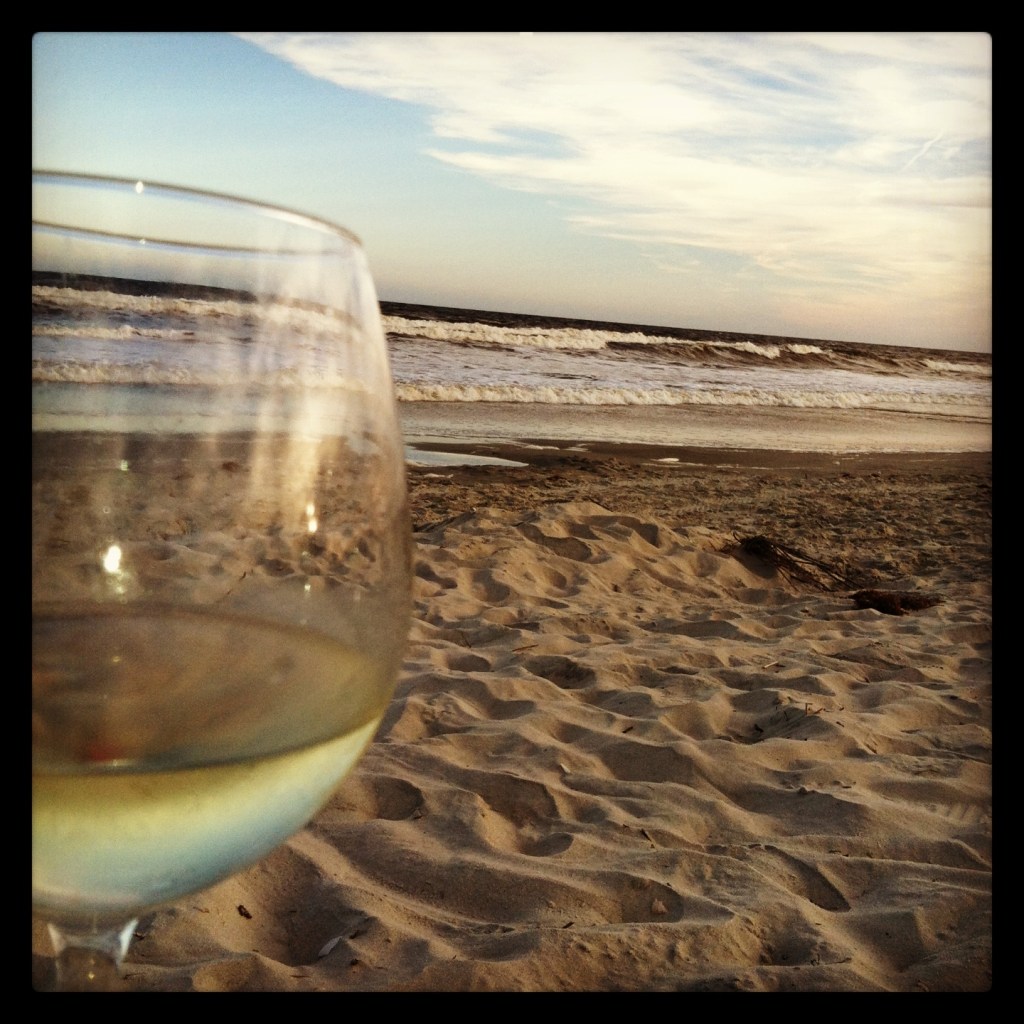 Wine, saltwater and sand is all I need.  This is what heaven looks like
